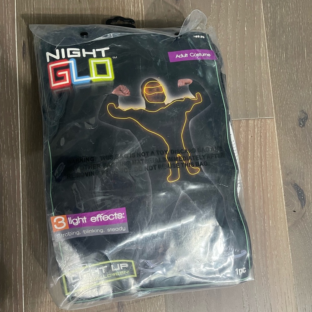 Kmart Night Glo adult light up costume. NWT lights up orange